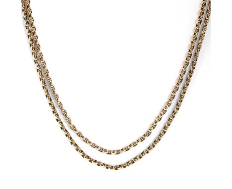 A gold muff chain, the slightly faceted belcher links with inner rings, with applied '9ct' cartouche, and tested as 9ct gold,