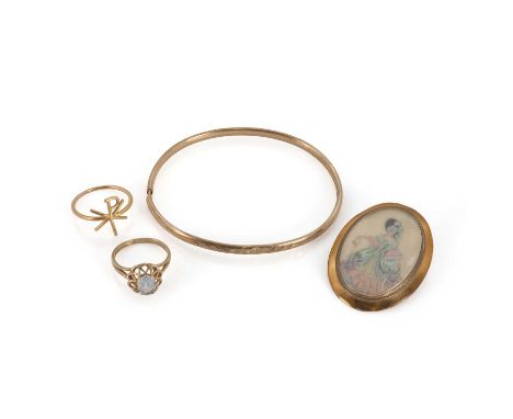 A group of 9ct gold jewels, comprising a hollow bangle, with floral engraving, stamped and tested as 9ct gold, with a 9ct gol