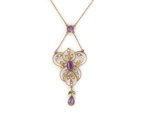 An Edwardian gold amethyst and seed pearl necklace, an oval cut amethyst to the centre, to an open curved wire frame, with fo