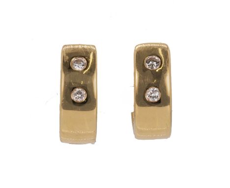 A pair of 18ct gold diamond cuff earrings, retailed by Susanna Lovis, with two round brilliant diamonds gypsy set to an oval 