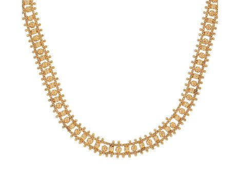 A gold repoussé link necklace, with a central row of alternating repoussé arches and flowers, to a double cable link chain bo