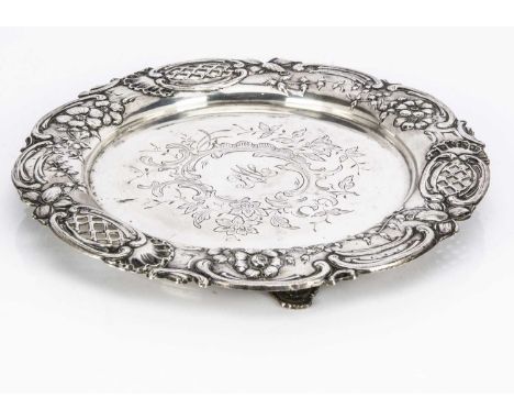 A first half 20th century Portuguese silver tray, 28cm diameter and 11.58 ozt, with raised and pierced decoration to rim, eng