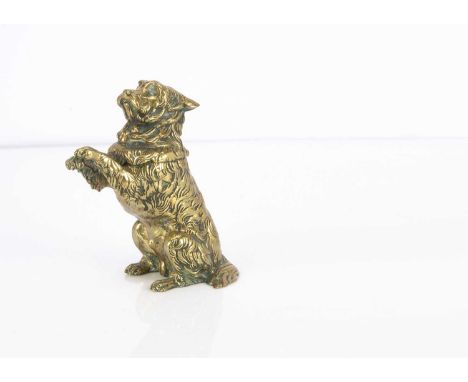 A Victorian or later brass novelty inkwell, in the form of a begging terrier with hinged lid and having Bakelite inkwell, 14c