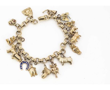 A yellow metal circular linked and baton linked bracelet with yellow and 9ct gold charms, the charm bracelet including an old