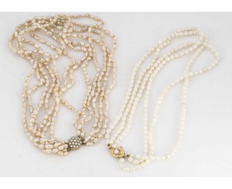 A multi strand freshwater pearl necklace, with 9ct gold tongue and box clasp, 47cm maximum, together with a three strand fres