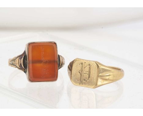 A carnelian 9ct gold signet ring, with engraved inscription, ring size O, together with a 9ct gold signet ring with engraved 