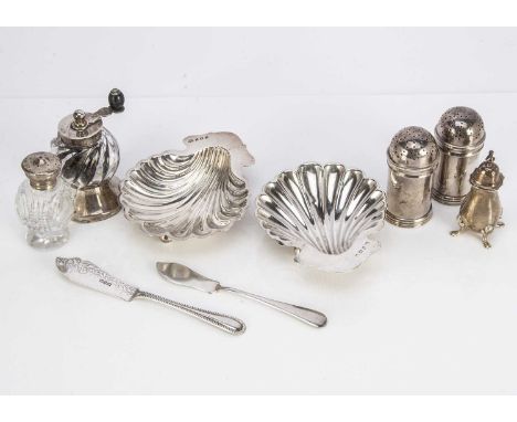 Nine Victorian and later silver table and cruet items, including a pair of shell shaped butter dishes, a pair of peppers, two