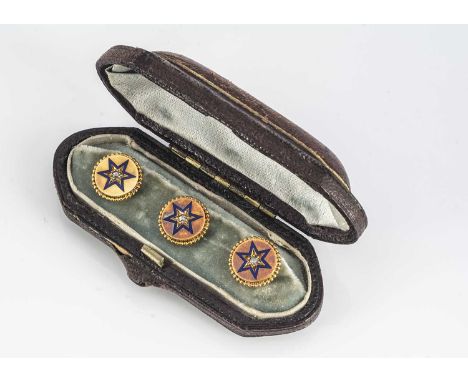 A set of three gold, diamond and enamel circular dress studs, the central old cuts in gypsy settings surrounded by an enamel 