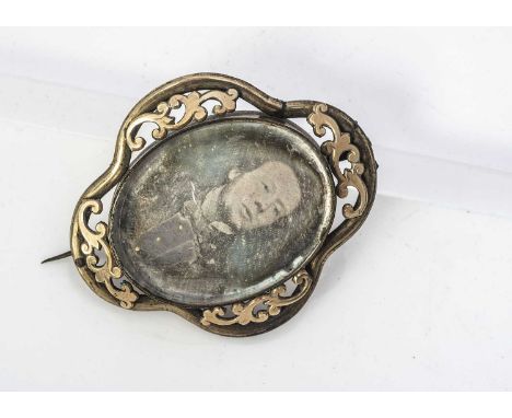 A 19th century Daguerreotype and pinchbeck brooch, the early photographic gentleman portrait with in an oval mount and ogee s