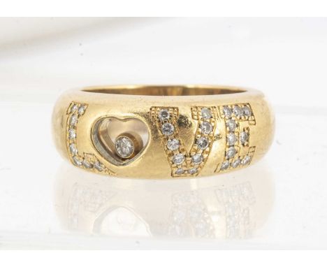 An 18ct gold Chopard LOVE dress ring, the letters and heart encrusted with small brilliant cut diamonds, inner shank marked C