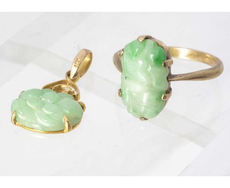 A 9ct gold and jadeite jade ring, the oval panel, with carved decoration, together with an oval drop pendant, ring size N, 4.