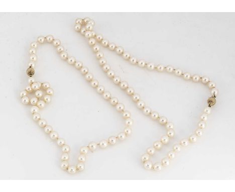 Two 9ct gold clasp cultured pearl necklaces, both knotted strung with matching ribbed sphere box and tongue clasp, approximat