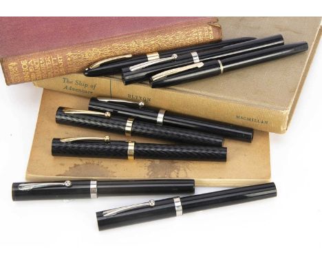 Eight Sheaffer fountain pens, each black, two in packet with calligraphy leaflet and two spare nib holders and nibs