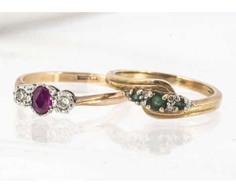 Two gem set 9ct gold dress rings, including an emerald and diamond crossover, ring size O and a ruby and diamond three stone,