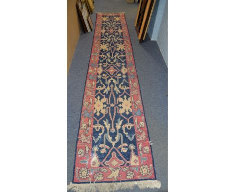EASTERN TRIBAL HEAVY FLAT WEAVE RUNNER with large repeat medallion pattern on a dark blue field, rose pink border having a pa