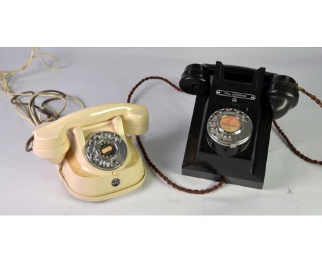 GPO BAKELITE BLACK WALL MOUNTED VINTAGE TELEPHONE, the hand set resting on the top, rotary dial to the front with label above