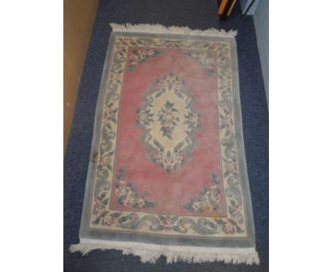 HEAVY QUALITY SUPER WASHED CHINESE EMBOSSED RUG OF AUBUSSON DESIGN, with plain rose pink field, off-white and floral oval cen