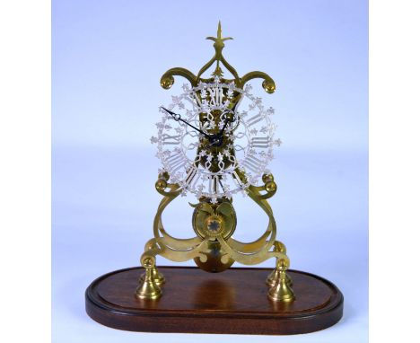 LATE VICTORIAN BRASS SKELETON CLOCK WITH CHAIN-DRIVEN FUSEE MOVEMENT with pendulum, pierced and silvered dial in the GOTHIC t