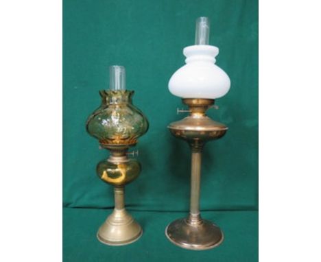 TWO VINTAGE BRASS OIL LAMPS, ONE WITH AMBER COLOURED RESERVOIR 