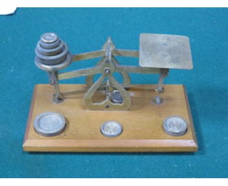SMALL SET OF BRASS WEIGHING SCALES ON WOODEN STAND 
