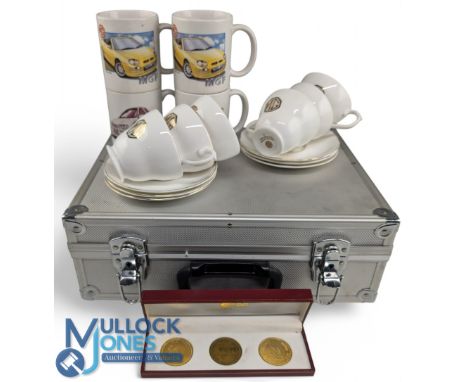 MG Car Collectables: a case of MG car themed mugs, china cup and saucers, a set of 3 Rover Longbridge 1995 tokens