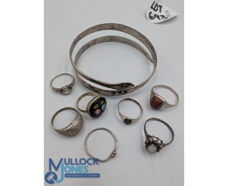 Collection of vintage silver and white metal rings and bangle: a snake bangle decorated with palm trees and ships, plus 7 lad
