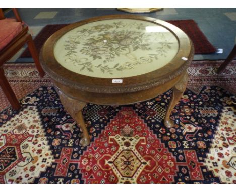 An Edwardian Walnut Circular Coffee Table with Tapestry Top.