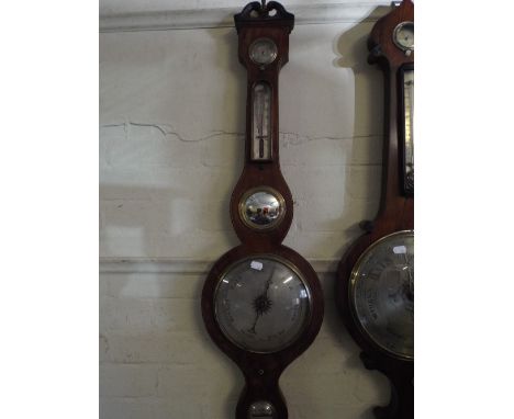 A 19th Century Mahogany Wheel Barometer by Thomson Harrold. 