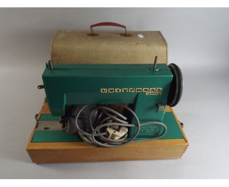 A Vintage Universal Sewmaid Sewing Machine.