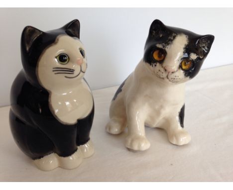 2 ceramic cats, one possibly a 'Winstanley' 14cm tall and a 'Quail' Simon 15cm tall.