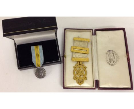 2 medals: 1) For meritorious civilian service to the U.S Air Force. 2) A gilt metal Masonic Royal Arch companions breast Jewe