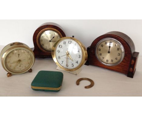 A box of vintage clocks to include a LSM German travelling alarm (in working order), a H.A.C. Tri-tone Tip-toe-tic alarm cloc