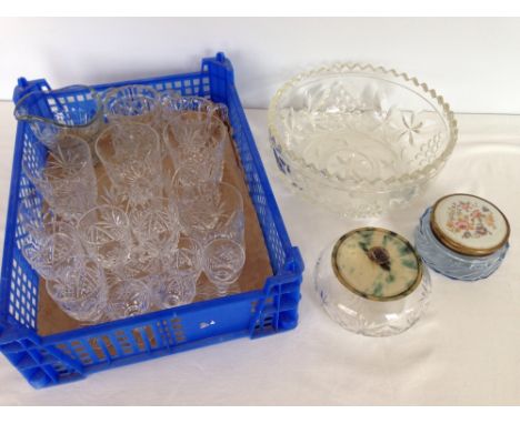 A collection of glassware, mostly matching lead cut crystal together with a glass fruit bowl and trinket pots.