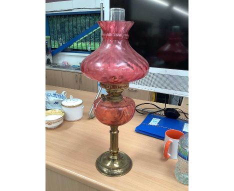 Cranberry glass and brass oil lamp with shade