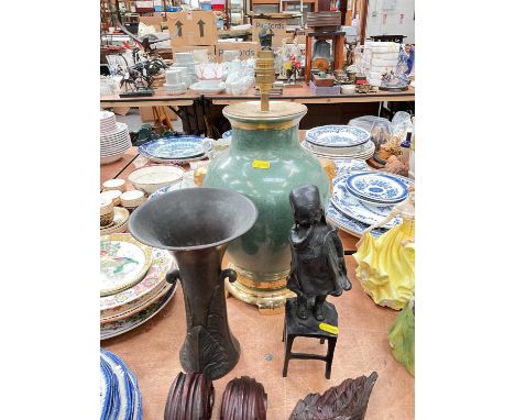 Bronze sculpture of a Dutch girl, together with a Gu form bronze vase and a lamp base. (3)