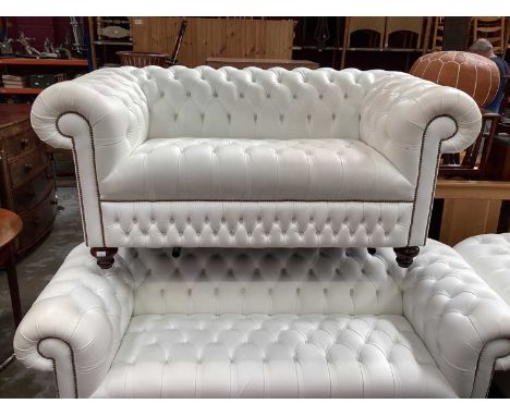 Chesterfield white leather three seater settee, two seater settee, armchair and foot stool, with labels for Sofa by Saxon (4)