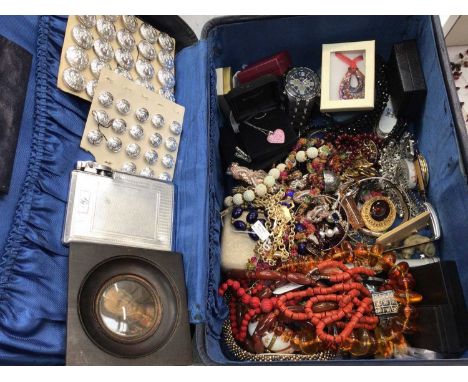 Vintage costume jewellery and bijouterie within a vintage suitcase