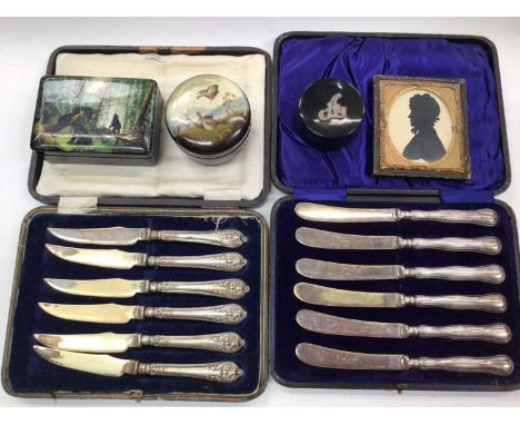 Set of six silver handled butter knives in fitted case, another plated set, three lacquered trinket boxes and a Victorian sil