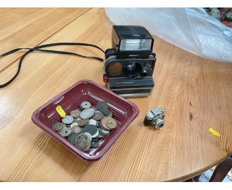 Crown miniature camera, Polaroid camera and group of coins.