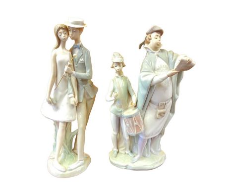 Two Lladro porcelain figures - Sweethearts and PregoneroChips to man's hat. Drummer has lost his drumsticks Please see additi