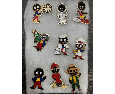 Small group of vintage golly enamel badges Notice from the the-saleroom.com: These items are listed on the basis they are ill