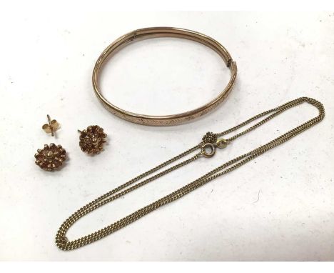9ct gold bangle, pair of 9ct gold flower earrings and a yellow metal chain9ct gold bangle and earrings weighs 8.1 gramsChain 