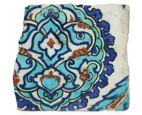 AN IZNIK TILE FRAGMENT, OTTOMAN ANATOLIA, CIRCA 1570-80  underglaze painted fritware, decorated with large arabesque medallio