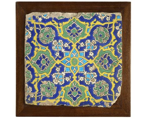 AN OTTOMAN CUERDA SECA TILE, WESTERN ANATOLIA, FIRST HALF 16TH CENTURY  with a radiating design of lotuses around a central f
