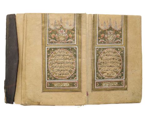 AN ILLUMINATED QUR'AN, OTTOMAN TURKEY, BY SALIM AL-ZAGRAVI, DATED 1876-7 A.D., a manuscript in arabic, with a opening double 