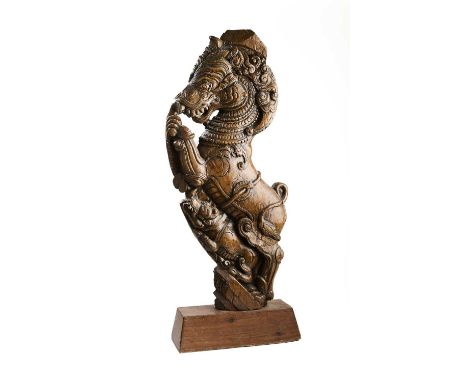 AN ARCHITECTURAL STRUT IN THE FORM OF A MYTHICAL LION (YALI), KERALA, SOUTH INDIA, 19TH CENTURY  carved wood, the rearing bod
