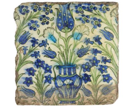 A LARGE DAMASCUS TILE, OTTOMAN SYRIA, CIRCA 1600  underglaze painted fritware, of square form, depicting in apple green, coba