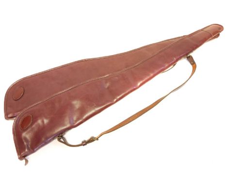 Pair of Boss &amp; Co. London quality leather gun slips, makers label to the inside of one case. 128cm overall length.The cas