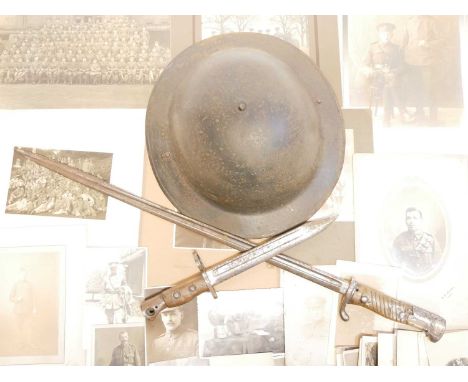 Lee Enfield No.5 bayonet, also a Mauser S.98 bayonet, Brodie helmet together with photographs of British soldiers and units.B