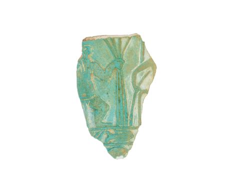 An Egyptian blue-green glazed faience fragment of a chalice, 3rd Intermediate Period, 1075-716 B.C., moulded in shallow relie